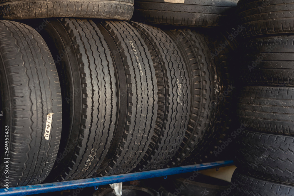 Obraz premium Secondhand used tires for sale at a vulcanizing shop.
