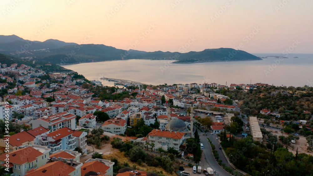 Aerial panoramic view of resort town on the Mediterranean coast, Turkey. Beautiful city architecture, sea and mountains. Travel to Turkey.