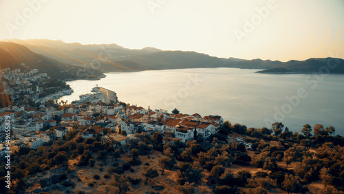 Sunset view of sea and resort town. Beautiful nature panorama from above. Travel and vacation concept.