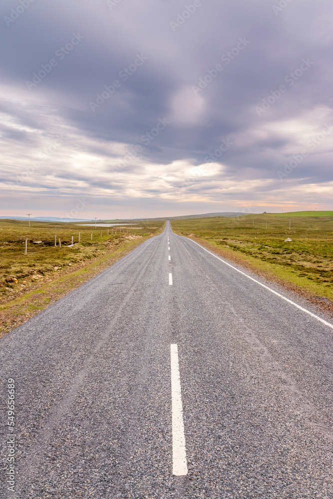 UK, Scotland, Unst, Clouds over empty asphalt road in Shetland Islands UK, Scotland, Unst, Clouds over empty asphalt road in Shetland Islands