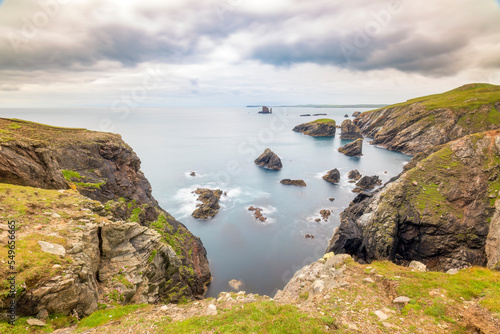 UK, Scotland, Sea stacks seen from Hillswick Ness photo