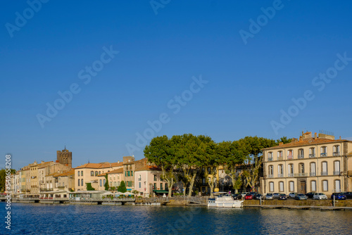 France, Occitania, Agde, Clear sky over riverside town photo