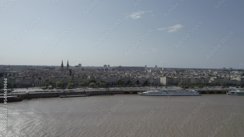 River cruises stationed in the Garonne wharfs at the shores of Chartrons neighborhood of Bordeaux France, Aerial dolly in shot River cruises stationed in the Garonne wharfs at the shores of Chartrons neighborhood of Bordeaux France, Aerial dolly in shot