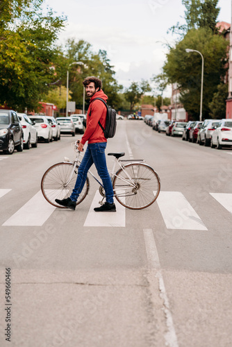 Wallpaper Mural Man crossing road with bicycle in city Torontodigital.ca
