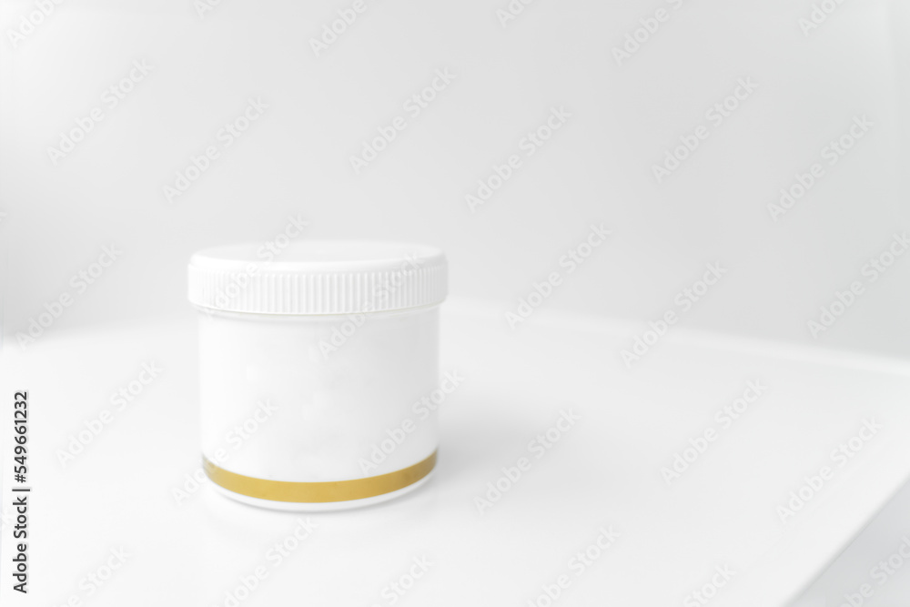 jar with white lid for cream with gold edging isolated on white background jar with white lid for cream with gold edging isolated on white background