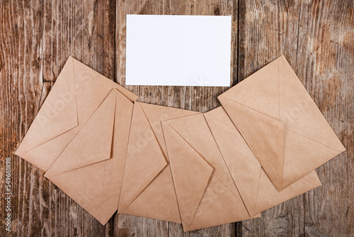 Envelopes made of craft paper and a white sheet of paper
