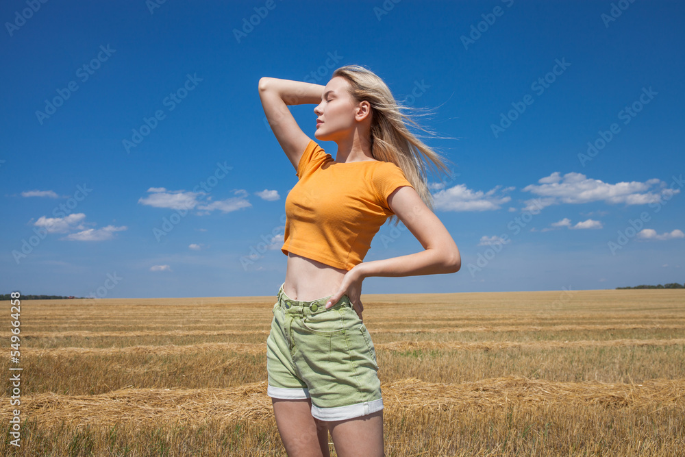 Young blonde model in wheat field Young blonde model in wheat field