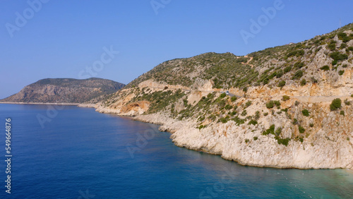 Spectacular view of rocky mountain and turquoise sea or ocean. Majestic nature landscape from drone.