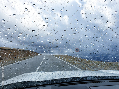 rain drops on windshield of car