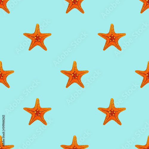 Seamless pattern of a marine, tropical theme. Bright Starfish. Watercolor hand drawn illustration. For decoration and design. On light blue background.