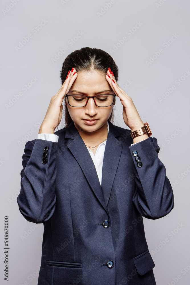 Psychology Mental Health or Migraine Headaches Unbearable Going over head Anxious Millenial troubled employee girl stressed and frustrated with timeline and work pressure with a headache. Psychology Mental Health or Migraine Headaches Unbearable Going over head Anxious Millenial troubled employee girl stressed and frustrated with timeline and work pressure with a headache.