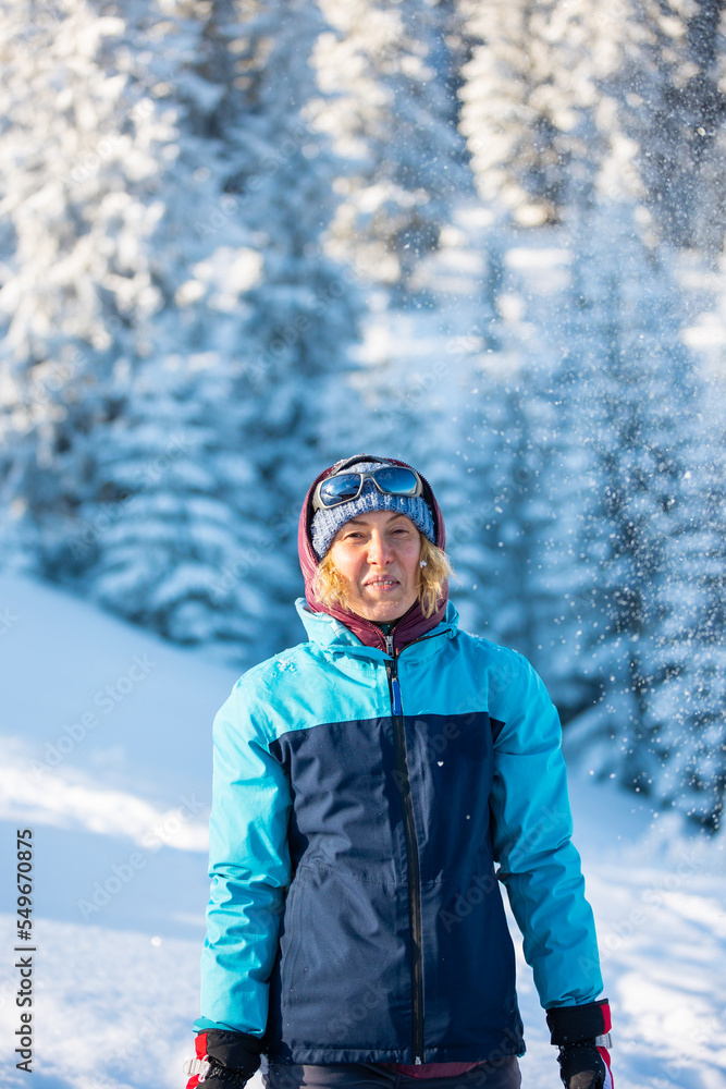 woman with a backpack in a winter hike woman with a backpack in a winter hike