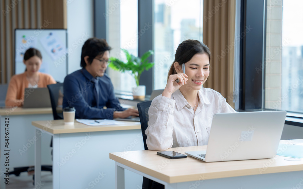 Group of businesspeople in smart casual clothes working together in office. Group of businesspeople in smart casual clothes working together in office.