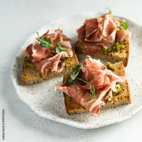 Toasts with ham and pesto