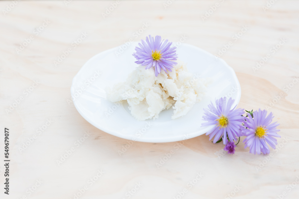 Shea butter on light background, unrefined, close up Shea butter on light background, unrefined, close up