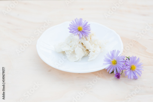 Shea butter on light background  unrefined  close up 