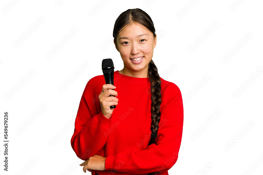 Young Chinese singer woman isolated laughing and having fun. Young Chinese singer woman isolated laughing and having fun.