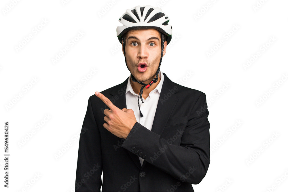 Business Caucasian man wearing a bike helmet isolated pointing to the side Business Caucasian man wearing a bike helmet isolated pointing to the side