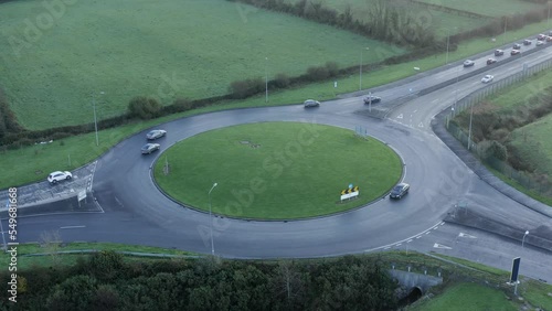 Aerial view of vehicle traffic on green highway roundabout in Ireland photo
