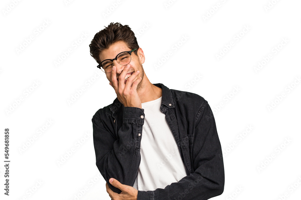 Young caucasian handsome man isolated laughing happy, carefree, natural emotion. Young caucasian handsome man isolated laughing happy, carefree, natural emotion.