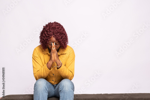 african lady saying her prayers © Confidence