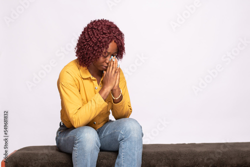 african lady saying her prayers © Confidence