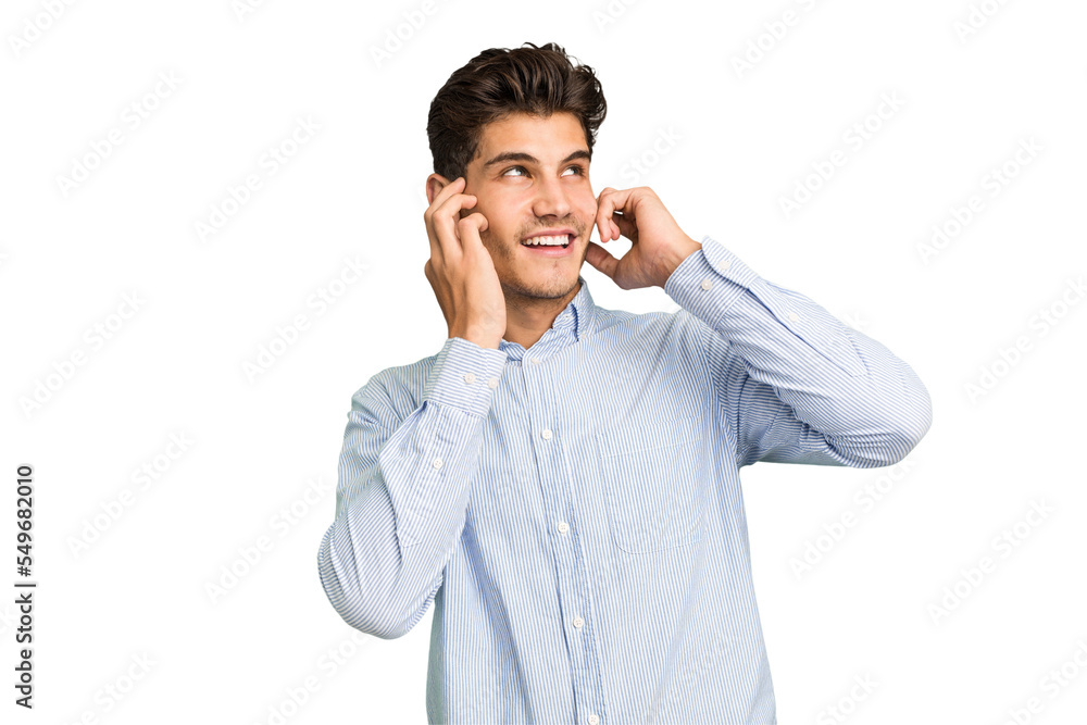 Young caucasian handsome man isolated covering ears with fingers, stressed and desperate by a loudly ambient. Young caucasian handsome man isolated covering ears with fingers, stressed and desperate by a loudly ambient.
