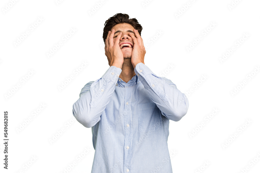 Young caucasian handsome man isolated laughs joyfully keeping hands on head. Happiness concept. Young caucasian handsome man isolated laughs joyfully keeping hands on head. Happiness concept.
