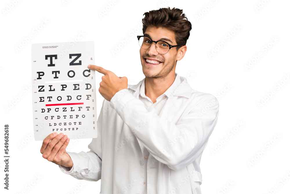 Young caucasian oculist man holding a optometry test isolated Young caucasian oculist man holding a optometry test isolated