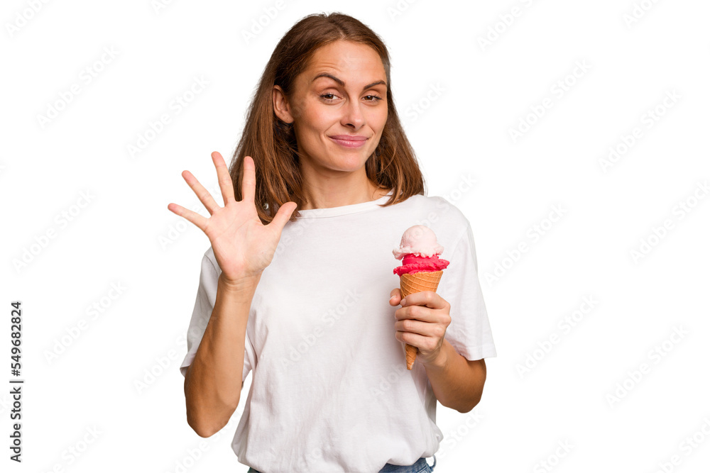 Young caucasian woman holding an ice cream isolated smiling cheerful showing number five with fingers. Young caucasian woman holding an ice cream isolated smiling cheerful showing number five with fingers.