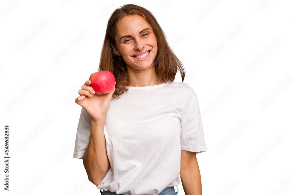 Young caucasian woman holding a red apple isolated happy, smiling and cheerful. Young caucasian woman holding a red apple isolated happy, smiling and cheerful.
