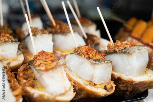 Photography Snacks with cod fish in tapas bar in Spain, traditional Spanish food