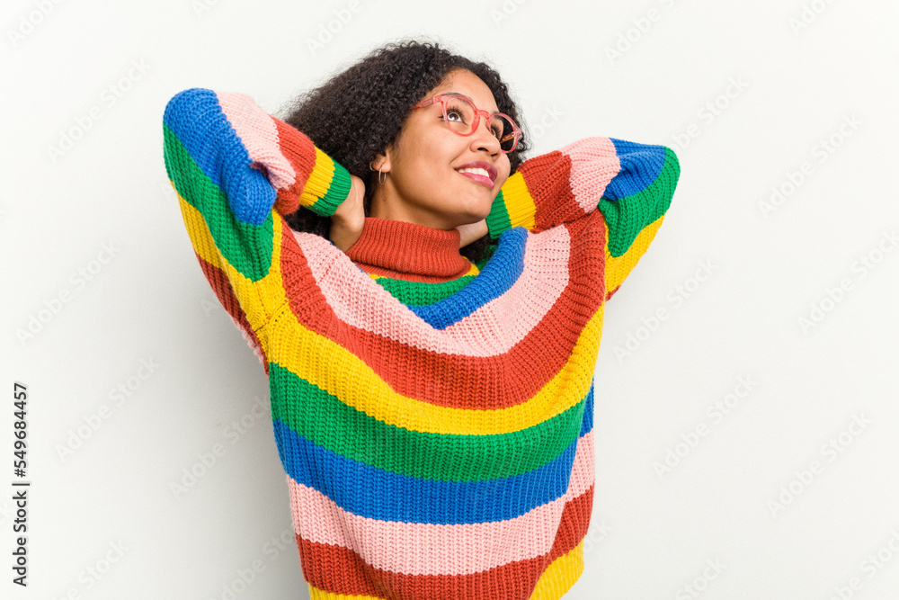 Young african american woman isolated on white background feeling confident, with hands behind the head. Young african american woman isolated on white background feeling confident, with hands behind the head.