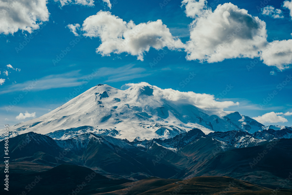 Big mountain Elbrus. Snow covered Greater Caucasus mountains. The two peaks of Mount Elbrus . Europe's highest peak. Journey to Kabardino-Balkaria. Russia. Big mountain Elbrus. Snow covered Greater Caucasus mountains. The two peaks of Mount Elbrus . Europe's highest peak. Journey to Kabardino-Balkaria. Russia.