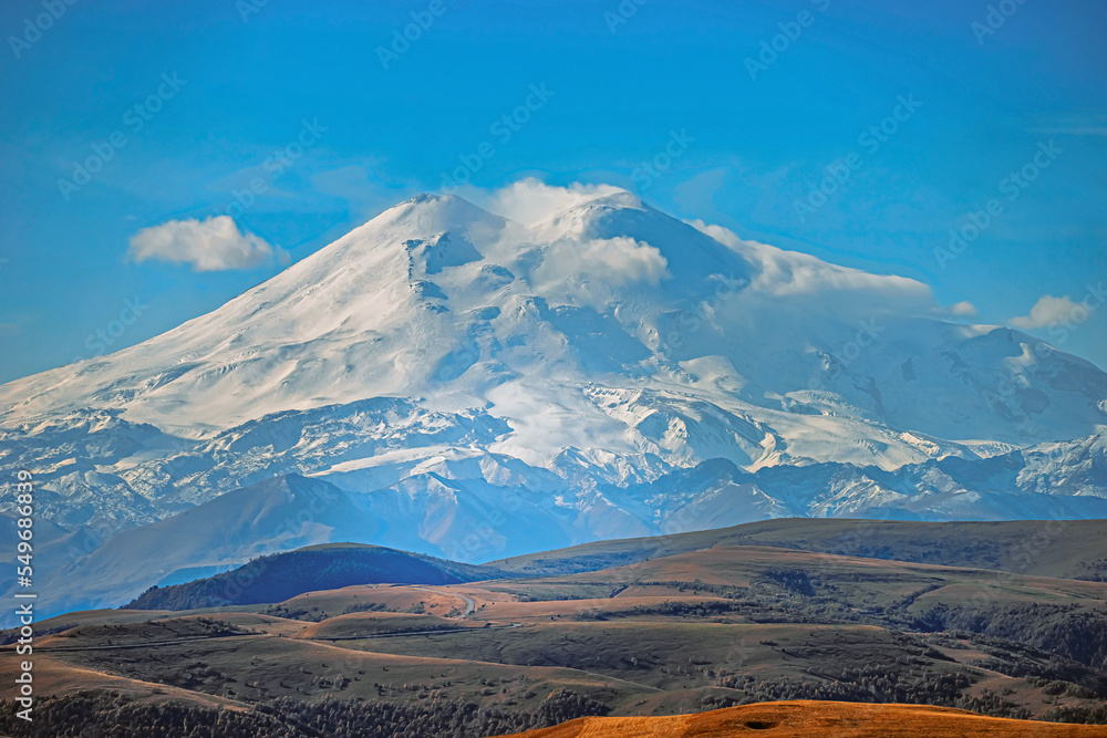 Big mountain Elbrus. Snow covered Greater Caucasus mountains. The two peaks of Mount Elbrus . Europe's highest peak. Journey to Kabardino-Balkaria. Russia. Big mountain Elbrus. Snow covered Greater Caucasus mountains. The two peaks of Mount Elbrus . Europe's highest peak. Journey to Kabardino-Balkaria. Russia.