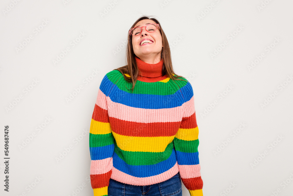 Young caucasian cute woman isolated on white background laughs and closes eyes, feels relaxed and happy. Young caucasian cute woman isolated on white background laughs and closes eyes, feels relaxed and happy.