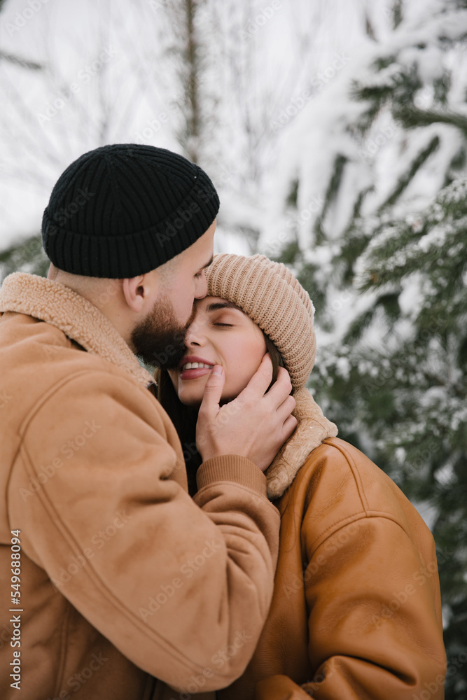 Fototapeta premium Couple in love are hugging in winter. Close up. 