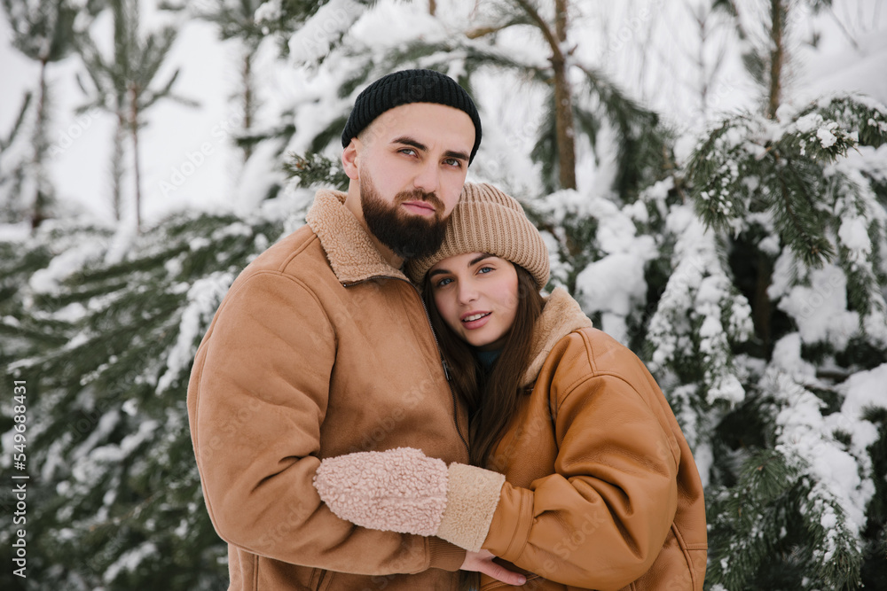 Couple in love are hugging in winter. Close up. Couple in love are hugging in winter. Close up.
