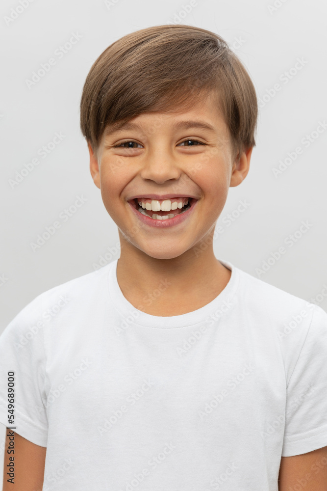 Portrait of smiling boy in a white t-shirt Portrait of smiling boy in a white t-shirt