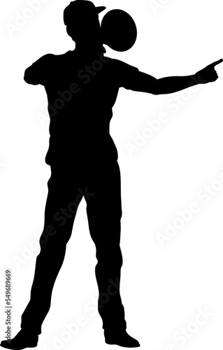 Protestor or demonstrator at a demonstration march, picket line or strike protest rally in silhouette. Using a megaphone, mega phone or bullhorn.