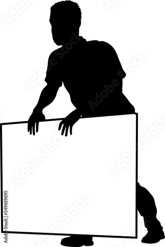 Protestor or demonstrator at a demonstration march, picket line or strike protest rally in silhouette. Holding up a banner or picket sign board placard.