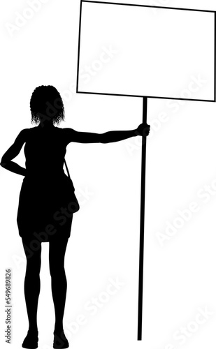 Protestor or demonstrator at a demonstration march, picket line or strike protest rally in silhouette. Holding up a banner or picket sign board placard.