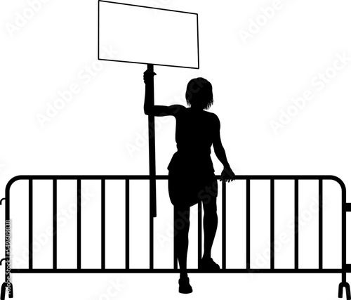 Protestor or demonstrator at a demonstration march, picket line or strike protest rally in silhouette. Holding up a banner or picket sign board placard.