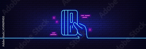 Neon light glow effect. Credit card line icon. Hold Banking Payment card sign. ATM service symbol. 3d line neon glow icon. Brick wall banner. Payment card outline. Vector