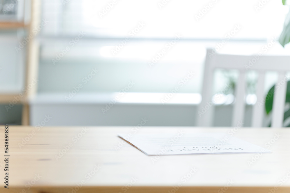 Shot of a contract paper on a desk in an office Shot of a contract paper on a desk in an office