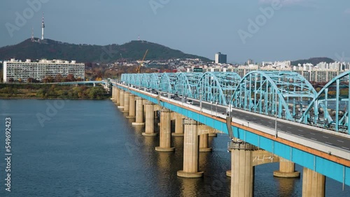 Dongjak Bridge Day Traffic Time Lapse, Line 4 Metro Train And Cars Fast Traveling in Seoul, South Korea photo