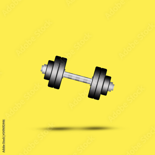 Dumbbell on a yellow background. Shadow. Copy space. Place for text. Sports equipment, gym, fitness. Sports