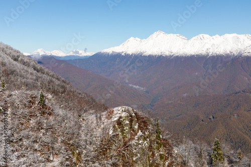 Freshly fallen snow in the mountains. Change of seasons in the mountains. Frosty autumn in the mountains. Features of nature in the mountains. The beginning of winter in the mountains. © colorshadow