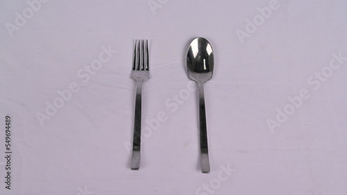 a spoon  fork on a white background