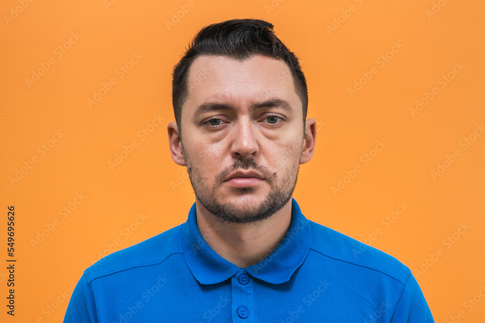 Portrait of the man on orange background. Man's emotions Portrait of the man on orange background. Man's emotions